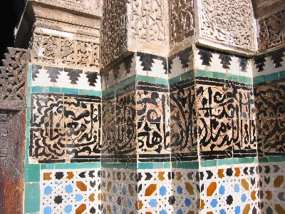 Mosaics and arabic script in the medersa in Fès